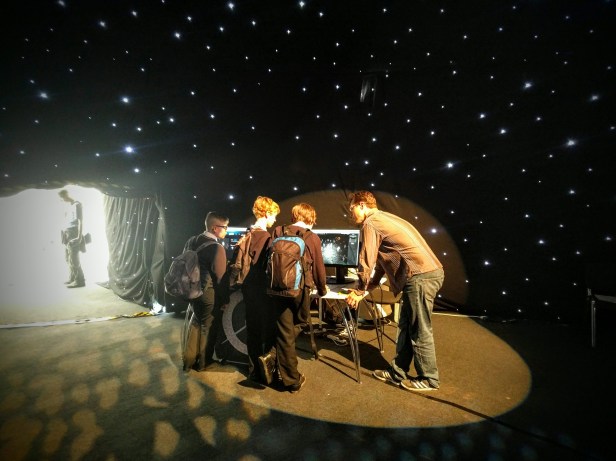 ZOoniverse lead back-end dev, Cam Allen, helps some of the younger generation get involved in Penguin Watch.