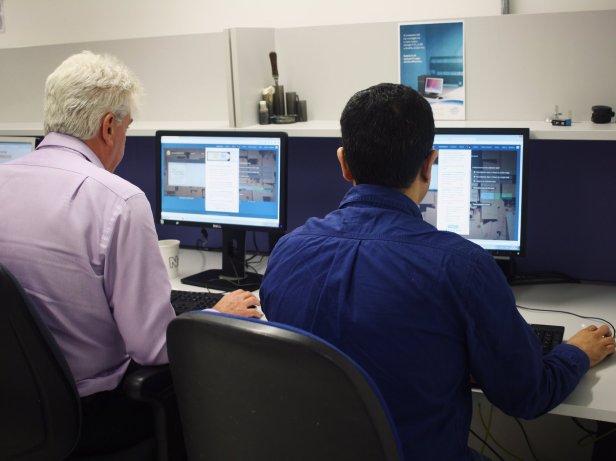 Two volunteers at the Natural History Museum perform some transcriptions on Notes for Nature as part of the WeDigBio event.